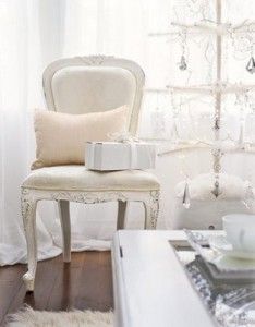chair_white cream Christmas tree_Christmas Tree Decorating Ideas_Country Living